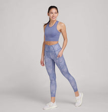 Load image into Gallery viewer, woman in high waisted blue leggings and crop top