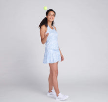 Load image into Gallery viewer, woman throwing tennis ball wearing blue printed tennis outfit