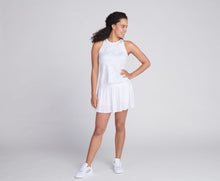 Load image into Gallery viewer, woman wearing white printed shirt and white pleated tennis skirt
